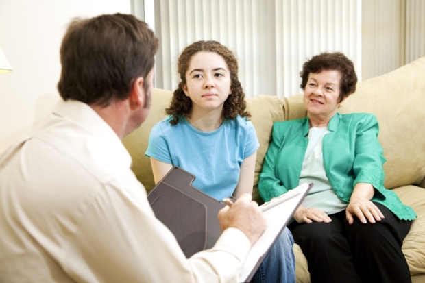 Caregiver and Family Speaking to Provider
