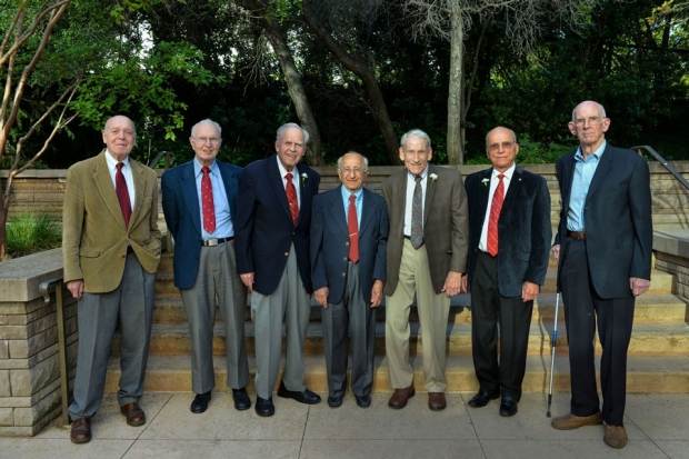 Group of seven male alumni