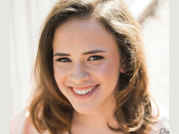 smiling headshot of Carla Dias