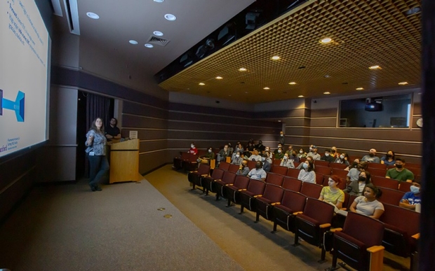 Munzer auditorium with audience, speaker, screen, and stage
