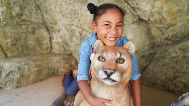 LPCH animal cave sculpture and smiling child