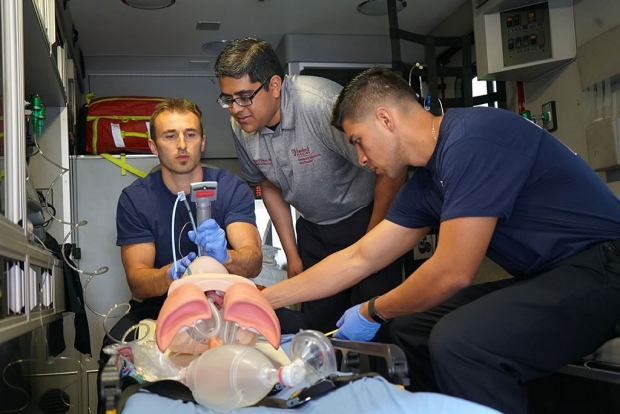 Physician Peter D’Souza and firefighters Brian Tognazzi and Yovan Sierra