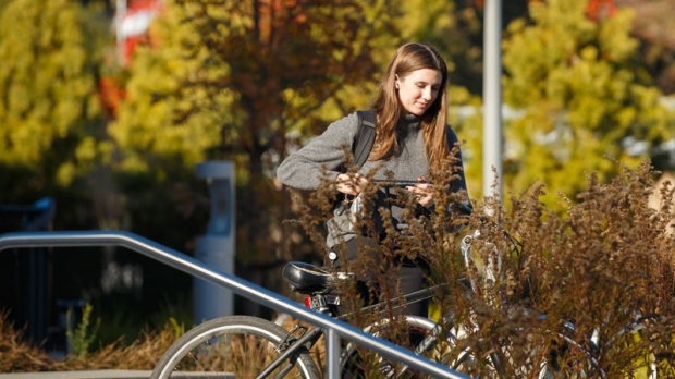 Woman parking a bike