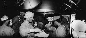 Norman Shumway and colleagues performing the nation's first successful heart transplant on a 54-year-old steelworker in 1968