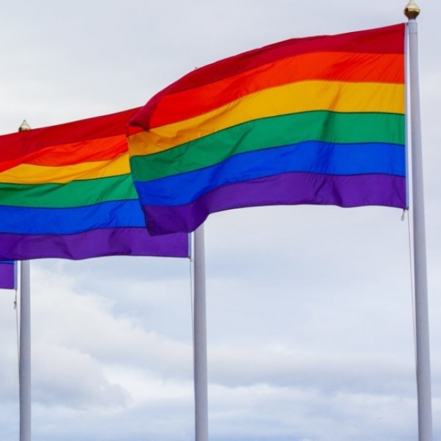 Photo of pride flags side by side by Jasmin Sessler