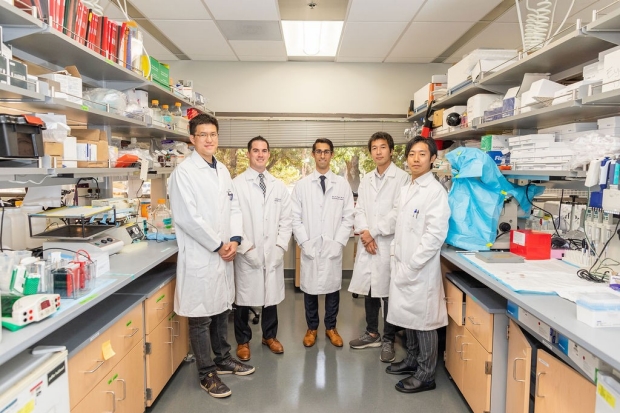 group photo of 5 people in a lab