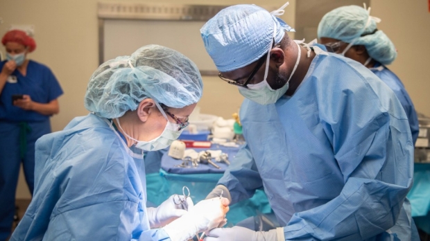 Dr. Brooke Gurland and Dr. Wilson Alobuia perform surgery