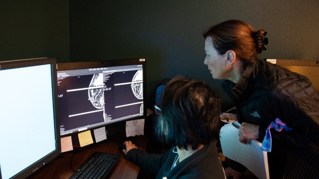 Dr. Mardi Karin looks at a breast scan at CCSB.