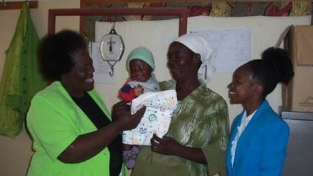 Zimbabwe researchers with baby