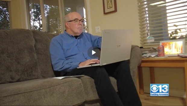 Don Kewman video screen capture - sitting on couch with laptop talking about clinical trials