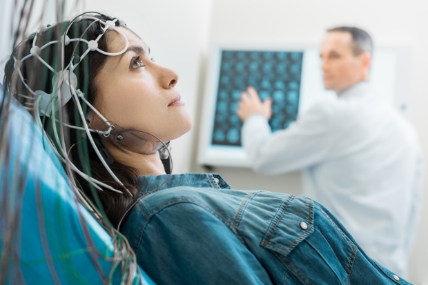 EEG patient and doctor with scans