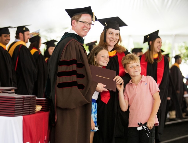 Dean Minor with graduate and her two children