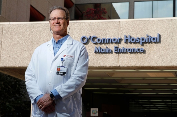 Doctor standing in front of O'Connor Hospital