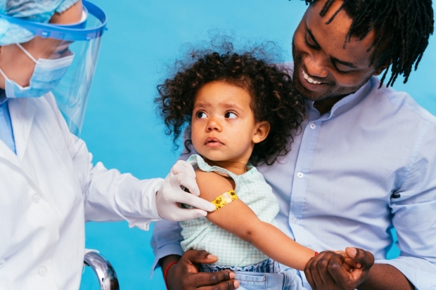 Child receiving COVID vaccine