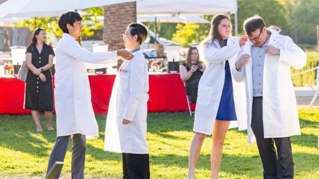 Incoming Stanford Medicine MD and PA students shed tears, don white coats