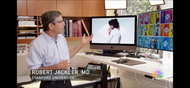 Dr. Jackler stanfind on front of computer monitors with JUUL ads displayed on them