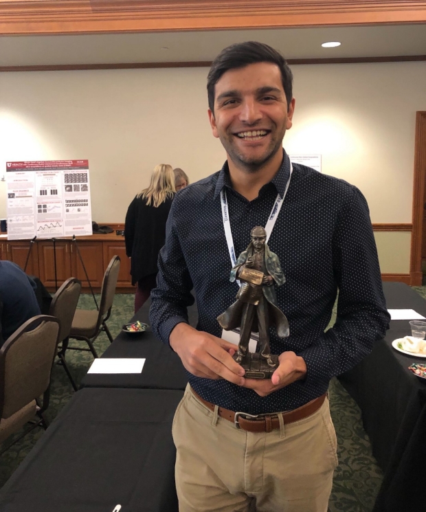 Photo of Akshay Chaudhari with Top Emerging Investigator award from the Imaging Elevated Symposium