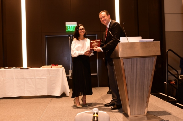Photo of Marcela Castro receiving 2019 LPCH Technician of the Year award from David Larson