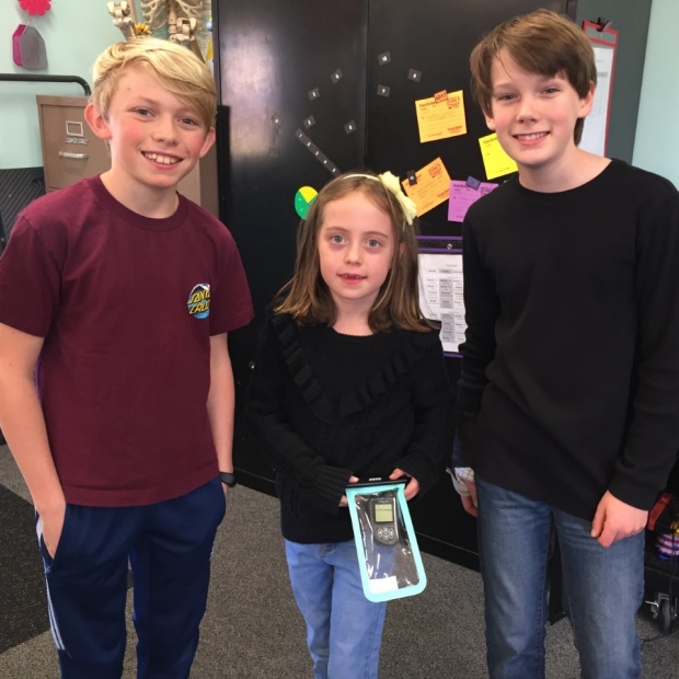 Jonah, Paige, and Oliver presenting the Splash Bag for Paige's PH pump at the Science and Engineering Expo at Oliver and Jonah's elementary school.